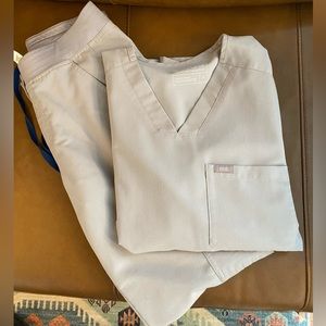 Figs size small scrubs, top and bottom. Cargo style bottoms